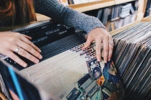 Person sifting through vinyl records