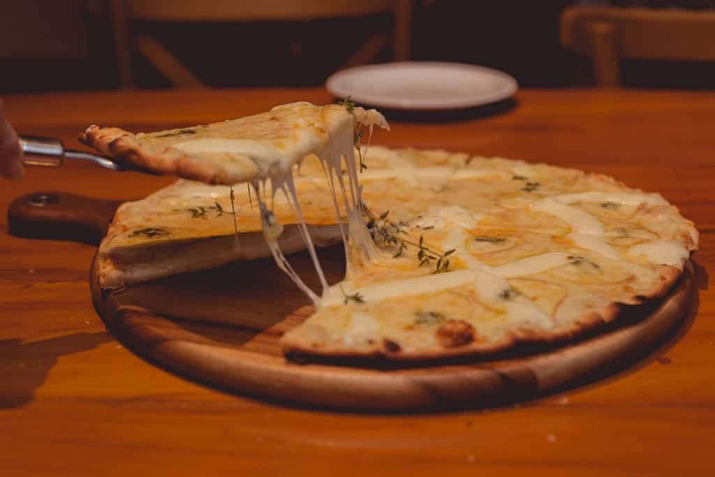 baked pizza with gooey cheese